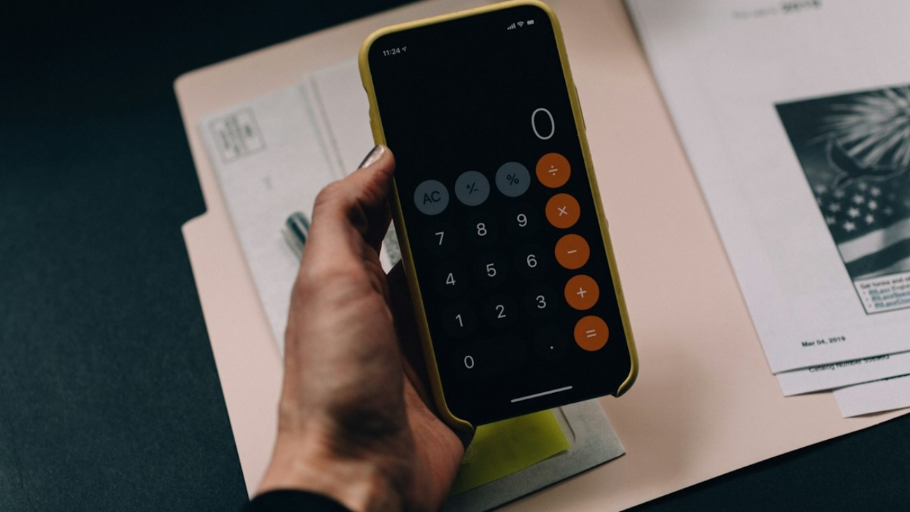Financial calculation and real estate contract desk scene